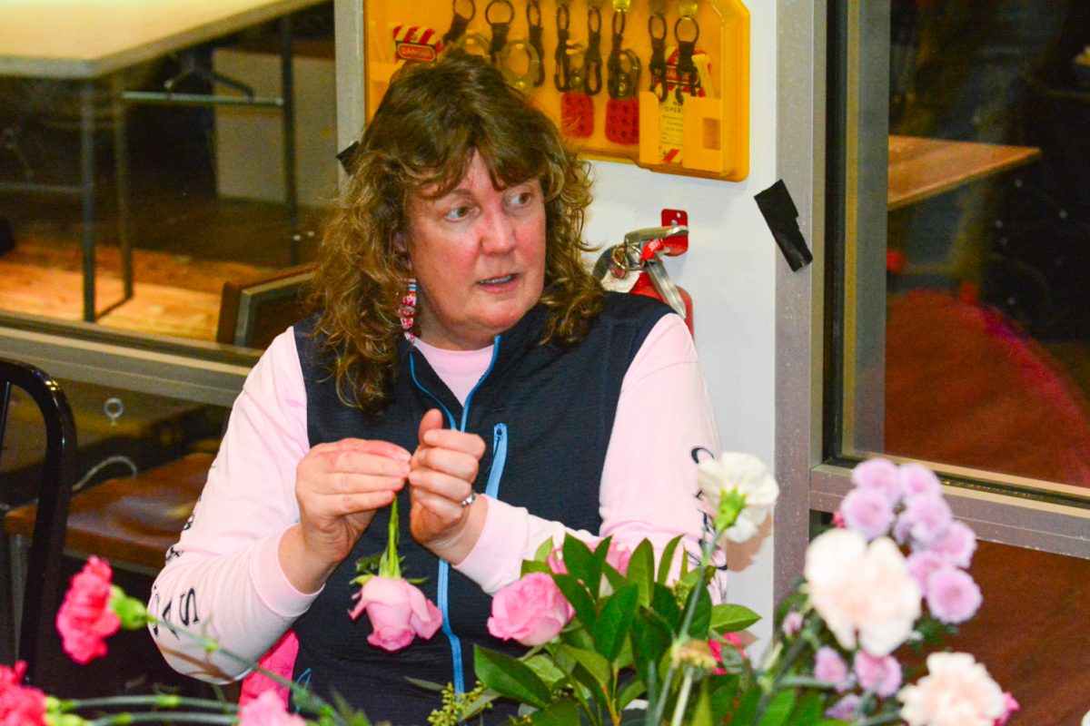 Christine Turner preparing a flower to put in her bouquet Feb. 13. This event was a Galantines Day Floral Workshop was celebrated at Breckenridge Brewery. 