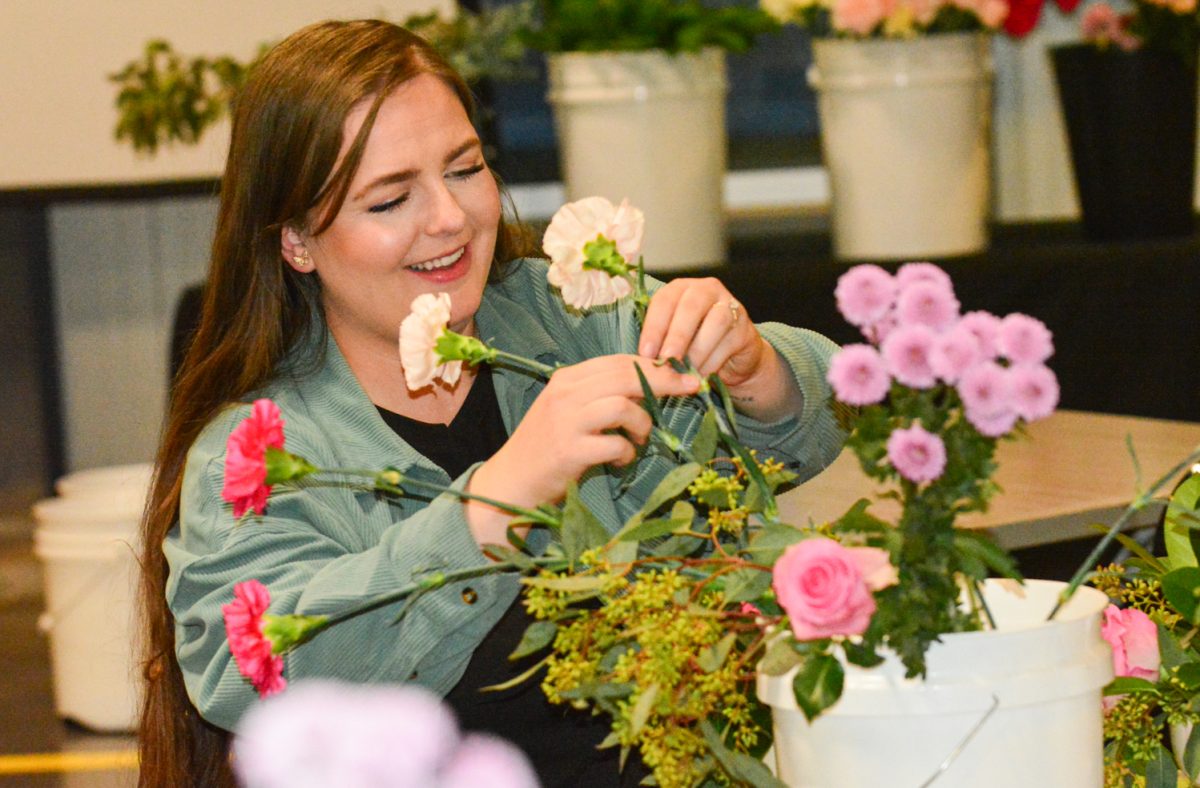 Lauren Curtis choosing which flowers to add to her bouquet while laughing with her mother Heidi Balcombe Feb. 13. This mother daughter duo attended the Galentines Floral Workshop hosted by Breckenridge Brewery. 