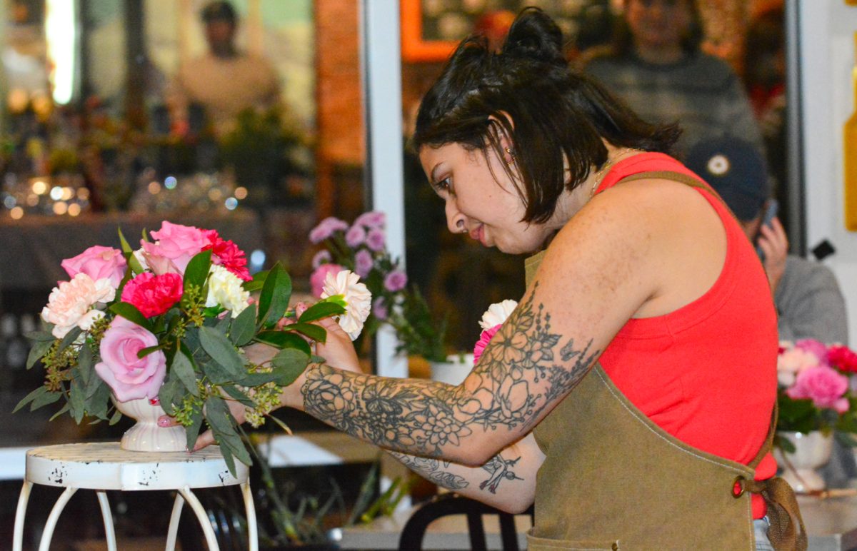 Elcee Evershed demonstrated how to properly place the flowers as the crowd watched Feb. 13. Elcee walked the crowd through the entire process during the Galentines Floral Workshop hosted by Breckenridge Brewery. 