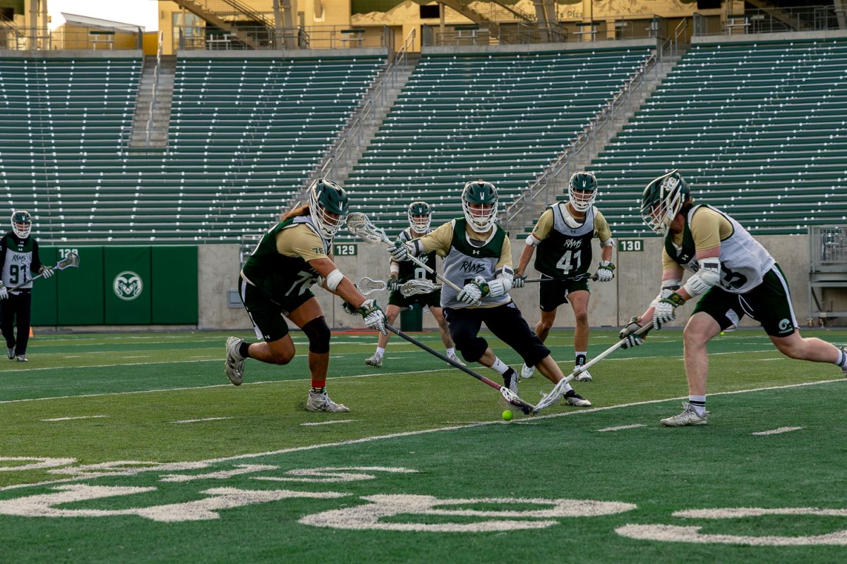 Kai Skaer (76) and other Colorado State University lacrosse players fight for the ball in a scrimmage to end practice Feb. 10. The team is preparing for their spring season, set to start Friday, Feb. 20.