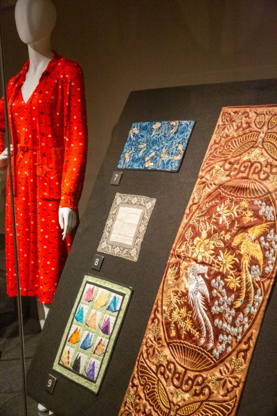 A black board stands at a diagonal with silks on it.