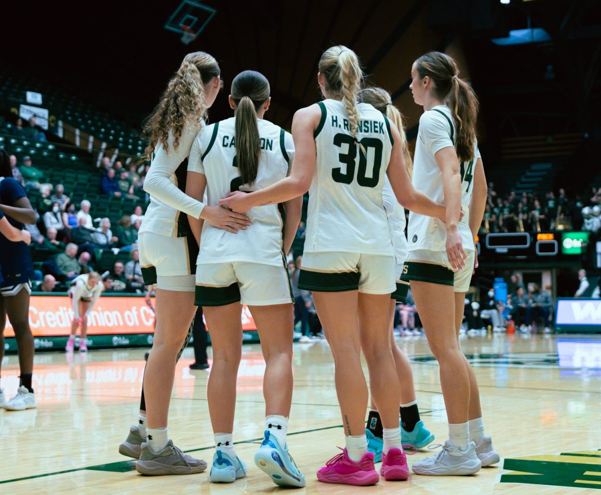 Colorado State University's Brooke Carlson (2) and Hannah Ronsiek (30) talk to teammates in between plays during CSU's game against Nevada in which CSU won 70-59 Feb. 18.