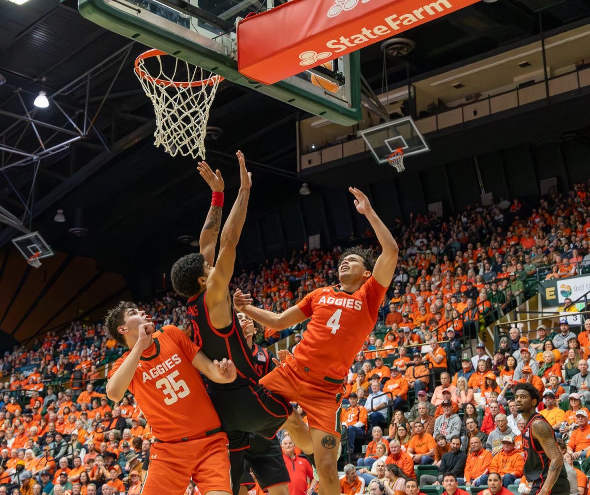 Colorado State University men's basketball guard Jase Butler (4) throws the ball hoping to score while being pressured by San Diego State University's defense Feb. 21. Butler was the highest scoring player for CSU this game, putting up 25 points. 