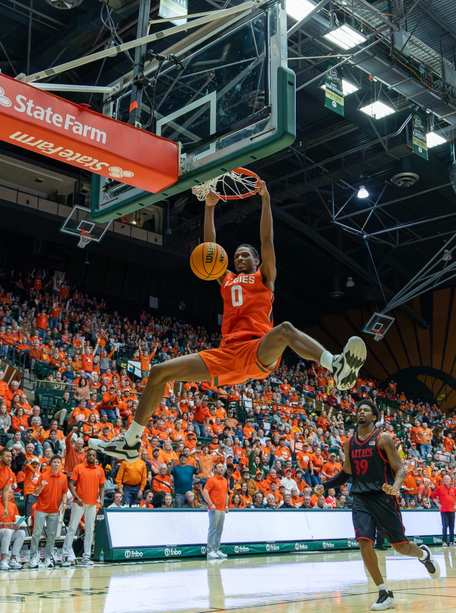 Colorado State University men's basketball forward Carey Booth (0) dunks the ball against San Diego State University Feb. 21. The Rams won against San Diego State 83-74. Booth put 22 points on the board for the Rams during the game.