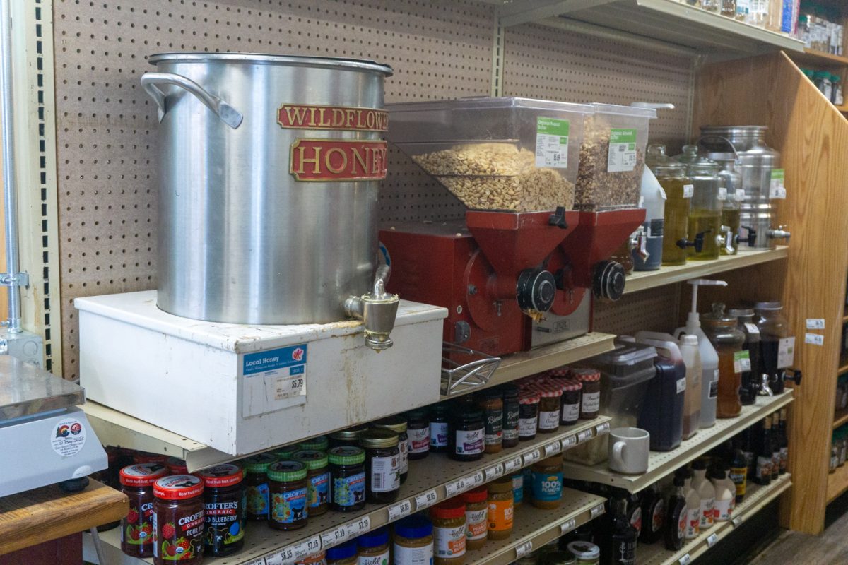 Bulk goods such as honey and fresh nut butter sit on a shelf at the new location of the Fort Collins Food Co-Op Feb 22. The shop reclocated from 250 E Mountain Ave to expand the store's offerings and services.