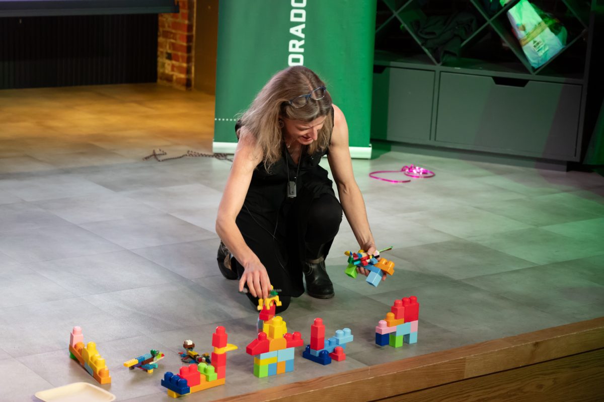 Dr. Rachel Mueller, an evolutionary biologist with a doctoral degree in integrative biology, takes her audience through a thought experiment considering why the size of cells in your body, or a salamander’s, matters Feb. 25. To facilitate this experiment she handed out bags of different sized legos before the talk began and told the audience to build the best salamander they could. “There’s a little bit more complexity in the salamander that’s built from the smaller legos, the bigger legos you’re just kind of blocky and simple,” Mueller said. “There’s a point where the building blocks get so large that the structure and the building block become almost one and the same.”
