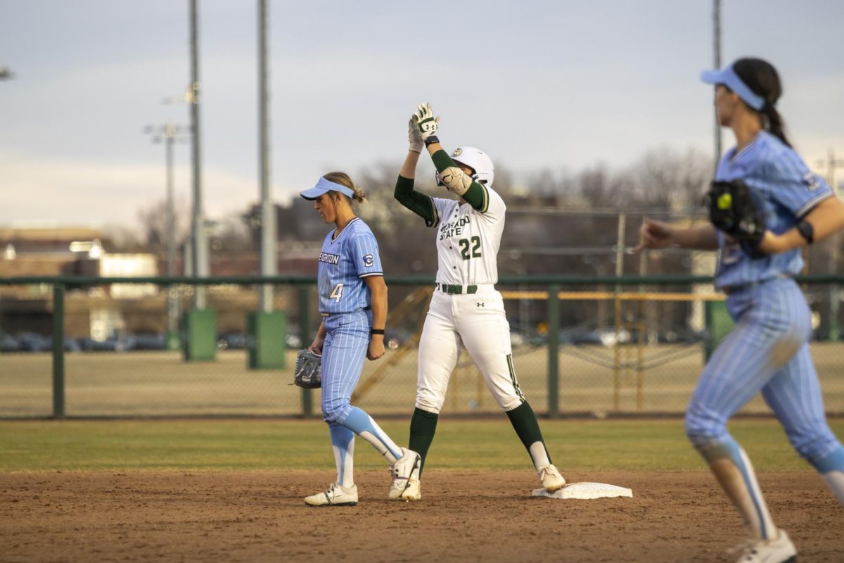 Kyra Smith (22) stands on second base belecrating her double hit during game against Creighton. The Rams won 6-2 at the CSU softball field on Feb. 28.