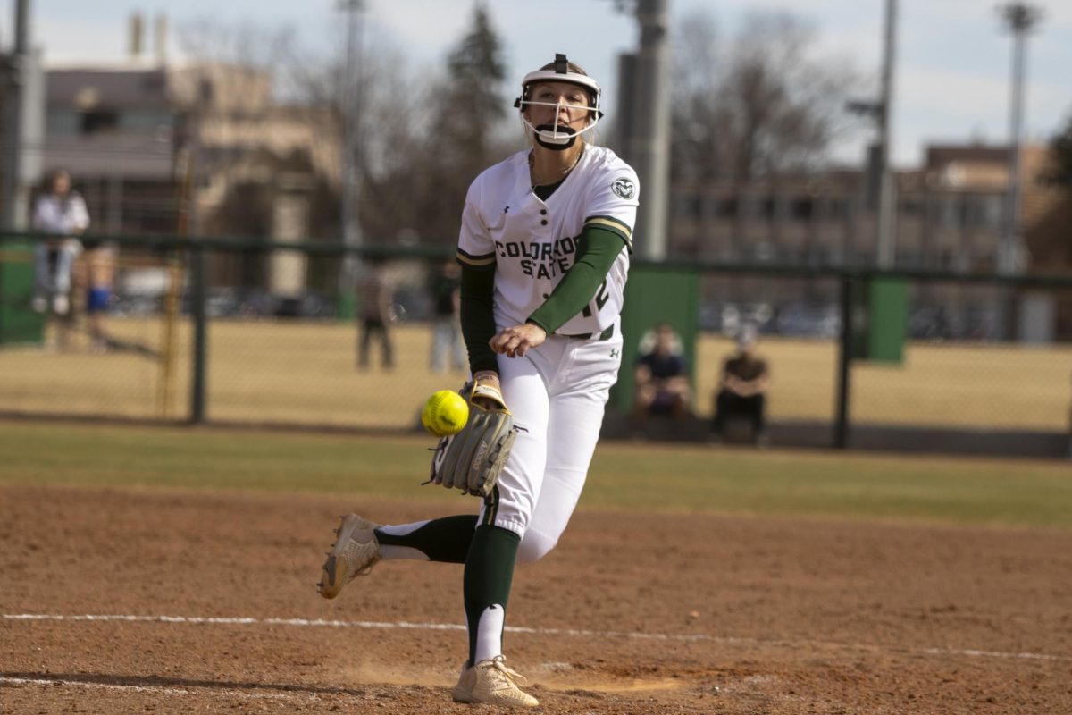 Pitcher Reagan Wick (12) pitches the ball during game against UNC. The Rams won 5-1 at the CSU softball field on Feb. 28.