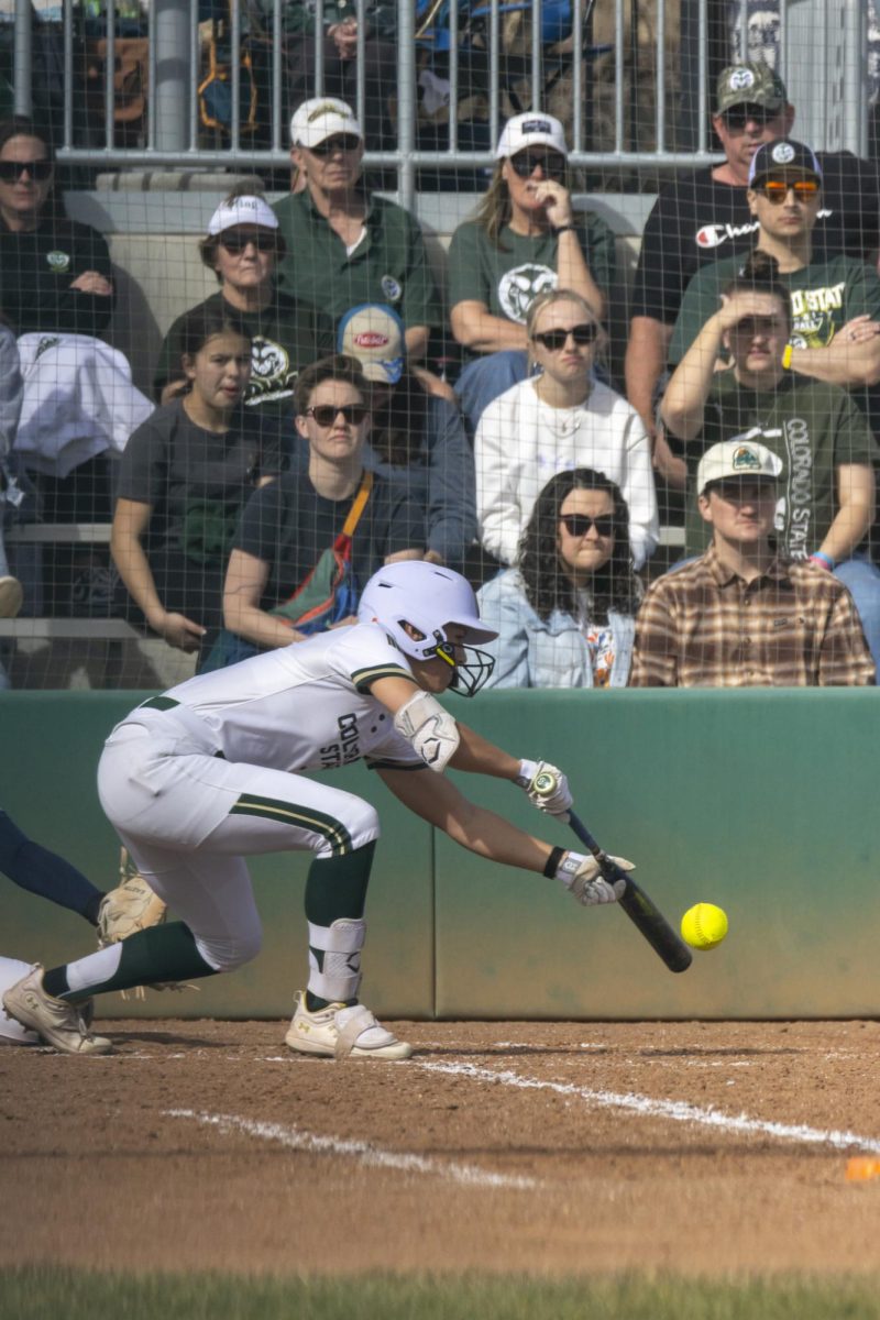 Autumn Rutherford (7) bunts the ball during game against UNC. The Rams won 5-1 at the CSU softball field on Feb. 28.