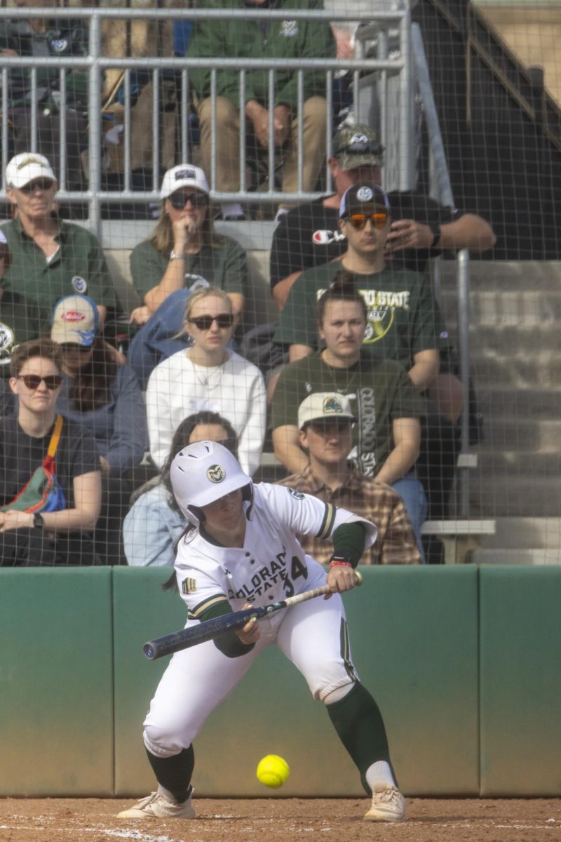 Abby Edwards (34) bunts the ball during game against UNC. The Rams won 5-1 at the CSU softball field on Feb. 28.