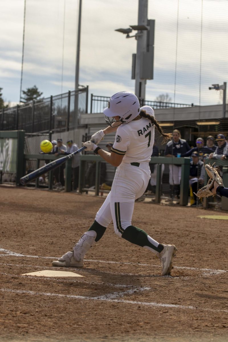 Autumn Rutherford (7) hits the ball during game against UNC. The Rams won 5-1 at the CSU softball field on Feb. 28.
