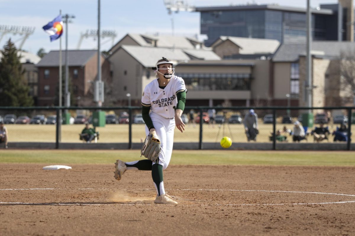 Pitcher Reagan Wick (12) pitches the ball during game against UNC. The Rams won 5-1 at the CSU softball field on Feb. 28.