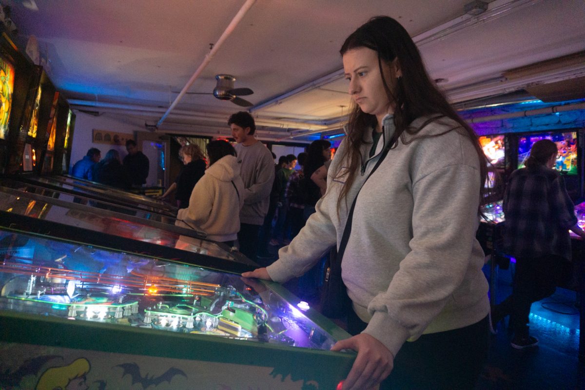 Ericka Stonebay plays a Scooby-Doo themed pinball game during the Women, Trans, Femme league at Pinball Jones Feb 12. Ericka Stonebay plays a Scooby-Doo themed pinball game during the Women, Trans, Femme league at Pinball Jones Feb 12. Stonebay, who helped establish the league, said the league's goal is to create a space for women, trans, and femme-identifying players in the world of pinball, which is a male-dominated sport.
