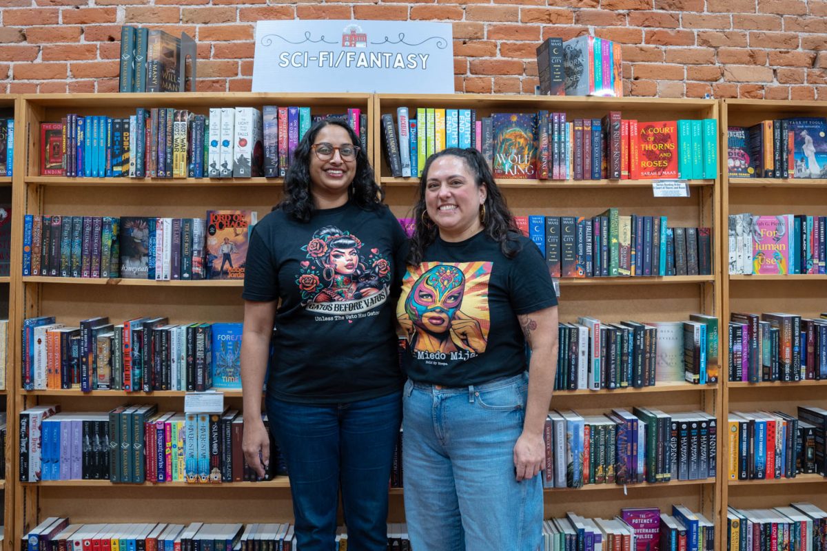 Teresa Steele and Revati Kilaparti stand in front of the science fiction section in Old Firehouse Books Feb. 13. "I've met people that I now know by name," Steele said. "We talk about books that they've come in to read."