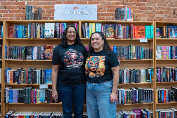 Teresa Steele and Revati Kilaparti stand in front of the science fiction section in Old Firehouse Books Feb. 13. "I've met people that I now know by name," Steele said. "We talk about books that they've come in to read."