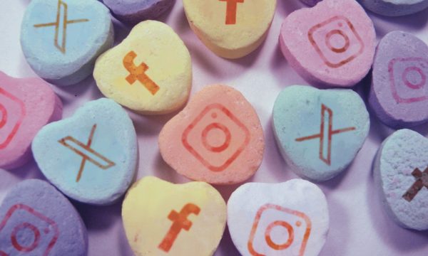 Sweetheart candies with social media platform icons on them 