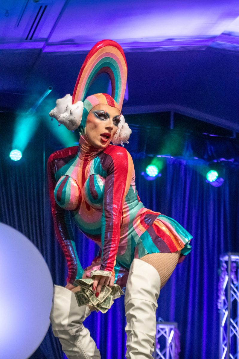 RuPaul's Drag Race season 18 contestant Nini Coco holds a handful of tips while performing her first number at the annual Colorado State University Drag Show March 29.
