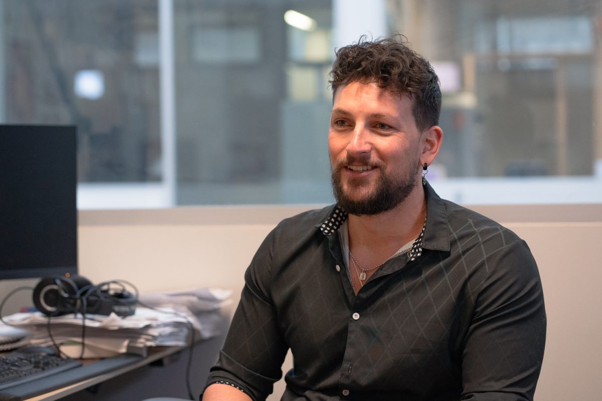 Colorado State University Assistant Professor of Psychology Keaton Fletcher discusses his podcast "Healthy Work" in his office at the Behavioral Sciences Building Wednesday, Feb. 25. Fletcher recently received the Joel Lefkowitz Early Career Award for Humanistic I-O Psychology from the Society for Industrial and Organizational Psychology for his research.