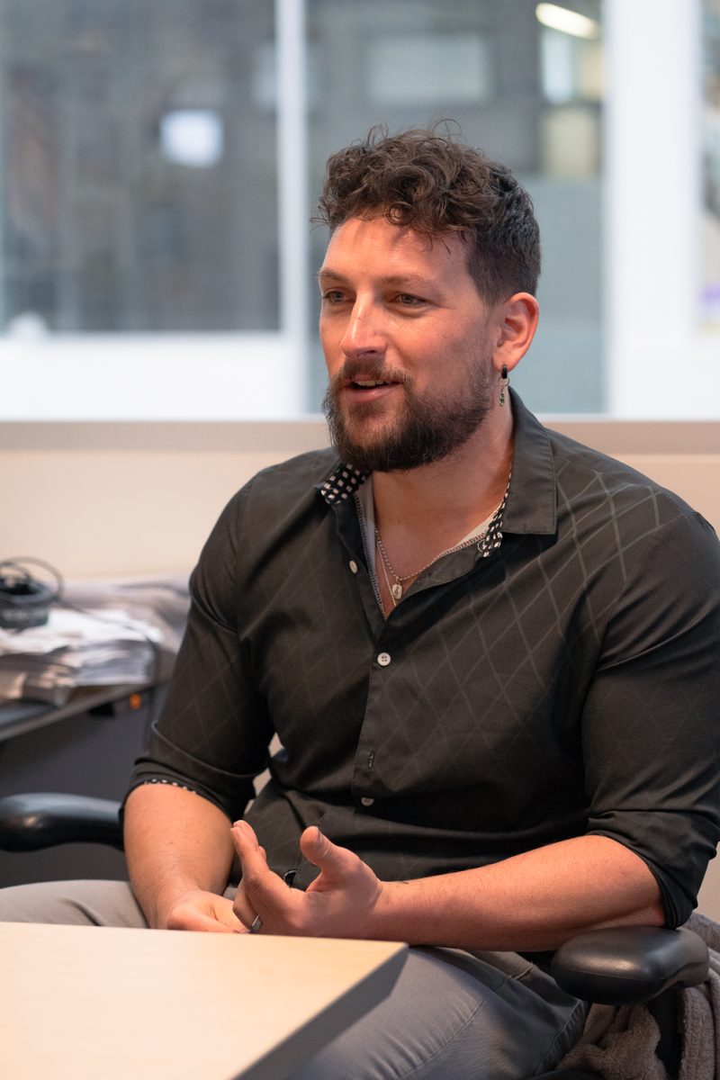 Colorado State University Assistant Professor of Psychology Keaton Fletcher discusses his work in organizational psychology in his office Feb. 25.  