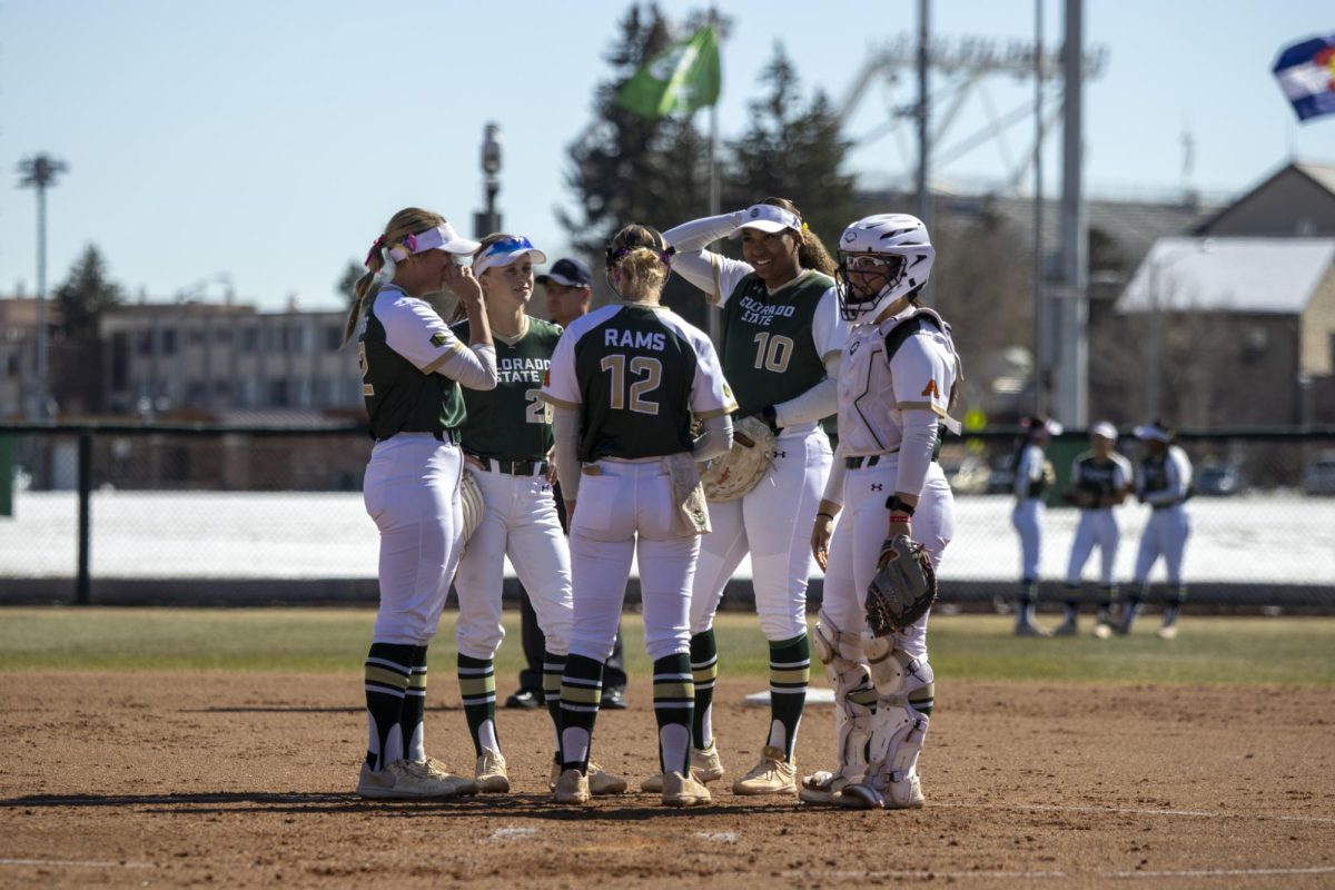The Rams huddle in the circle during Colorado State University’s first game against University of South Dakota March 7. The Rams won 4-2 at the CSU softball field.