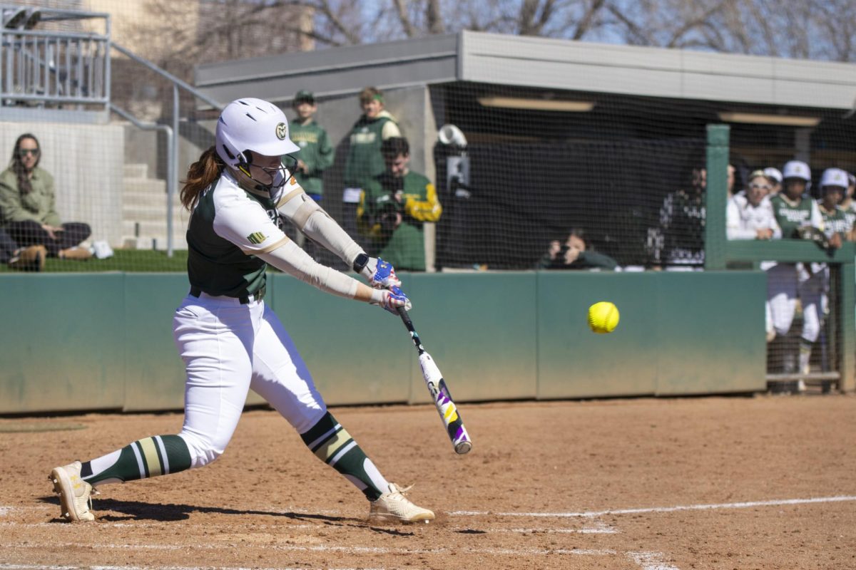 Madi Eslinger (13) hits the ball during Colorado State University’s first game against University of South Dakota March 7. The Rams won 4-2 at the CSU softball field.