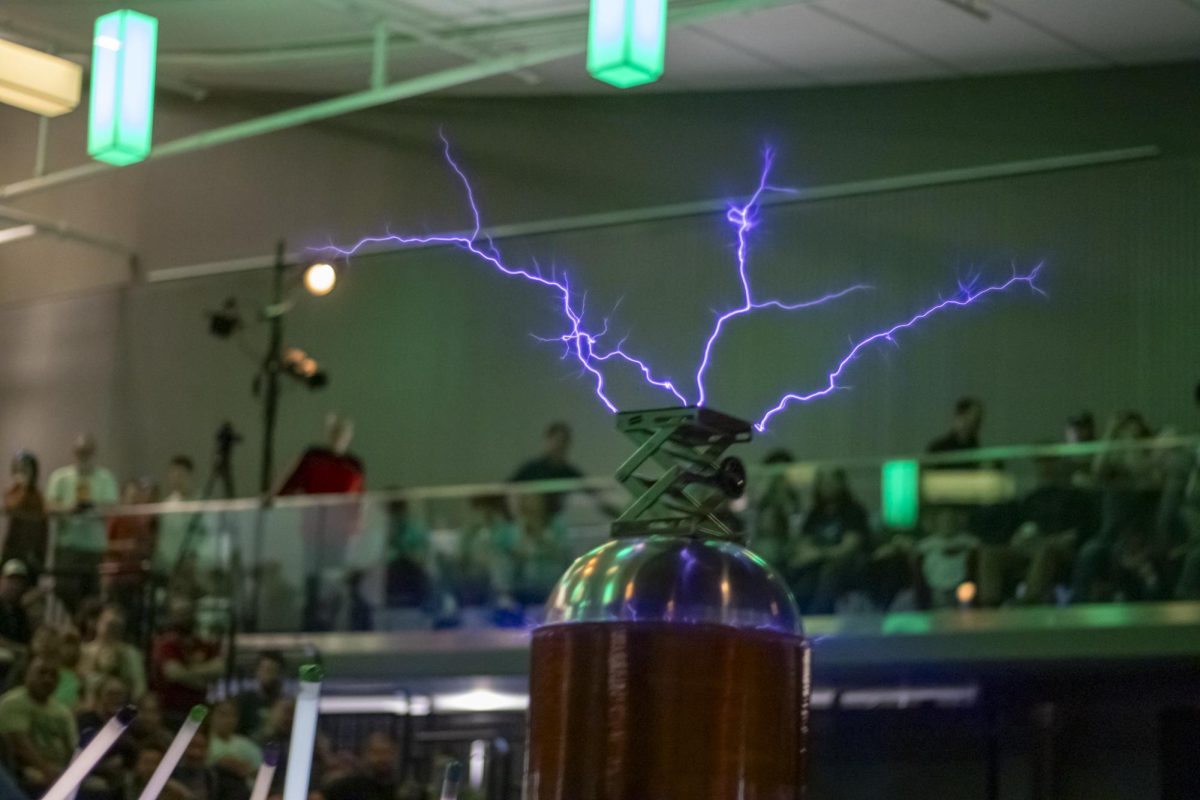 Purple bolts of electricity stem from a Tesla Coil during a live demonstration at the Little Shop of Physics 32nd Open House. The high-voltage show captivated crowds at the LSC March 1st.