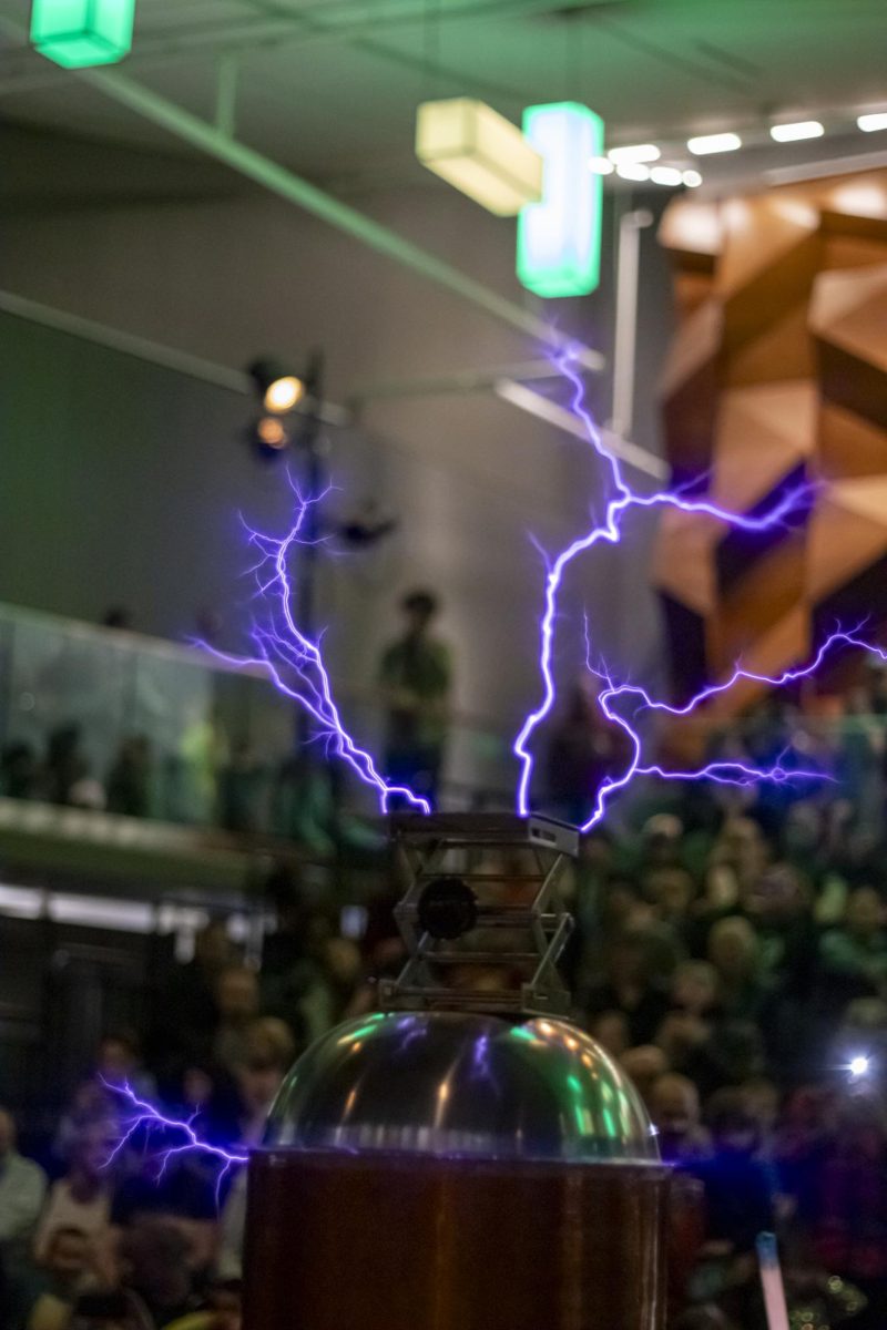 Purple bolts of electricity stem from a Tesla Coil during a live demonstration at the Little Shop of Physics 32nd Open House. The high-voltage show captivated crowds at the LSC March 1st.