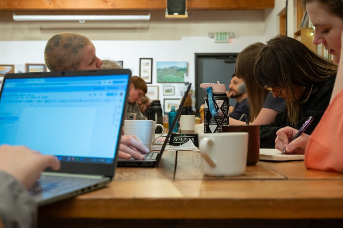 Participants in the evening's workshop sit around a table and begin drafting their responses to the first prompt Mar. 3. If they like the writing they’ve done at the workshop they can bring it to the Editorial Critique that is held the following Tuesday.