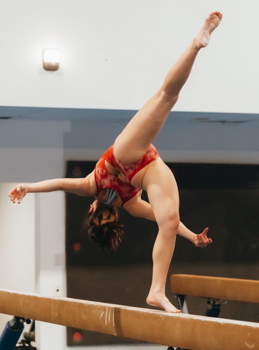 Olivia Heckman practices a front ariel for her beam routine at a Colorado State University Gymnastics Club practice Mar. 5.
