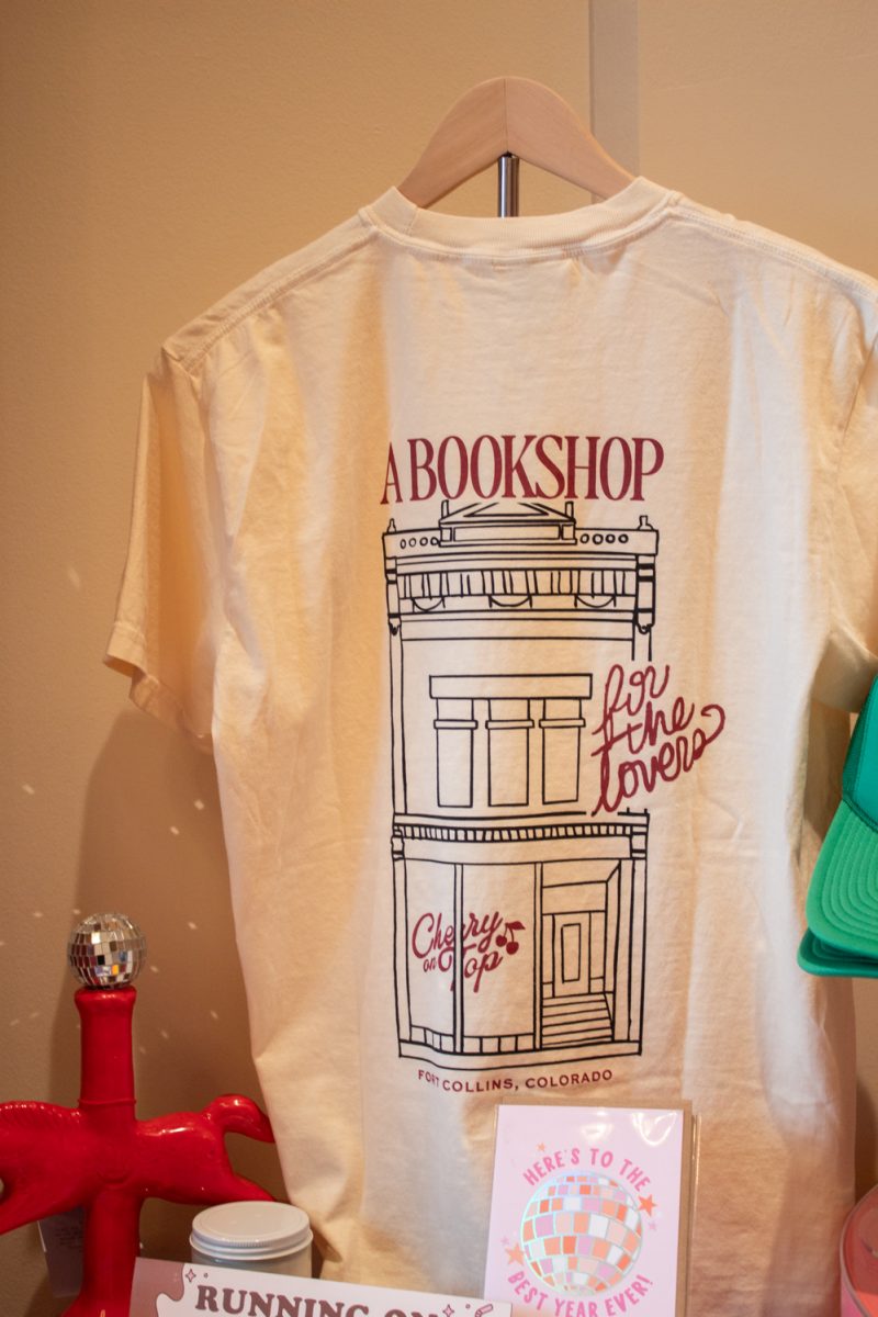 A display t-shirt depicts the bookshop Cherry On Top in Downtown Fort Collins Mar. 5. This romance-only bookshop, Fort Collins’ first, opened on February 13th of this year. “We carry romance and then a lot of the subgenres of romance. And we have a kid’s section, we have a few nonfiction books, and then obviously some retail,” co-owner Meredith Glover said.