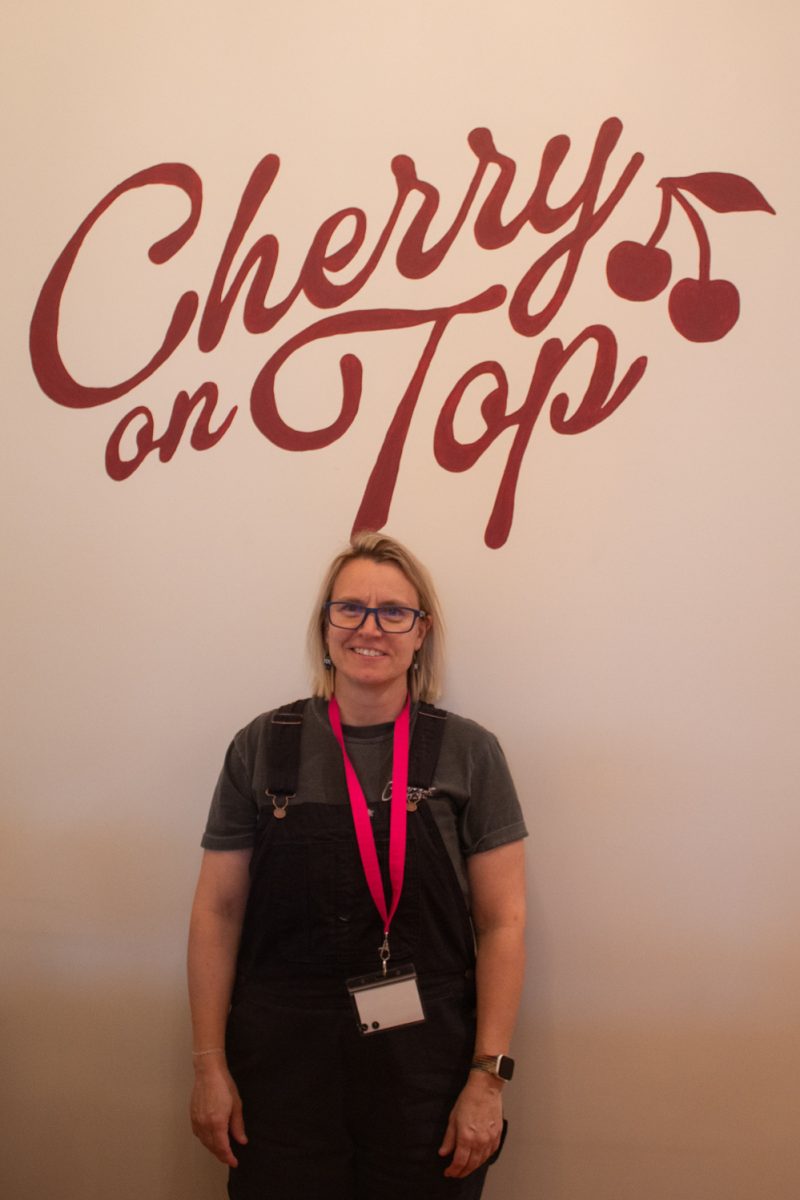 Meredith Glover, co-owner of Cherry on Top, a romance-only bookshop located in Downtown Fort Collins, poses for a photo inside her store. The shop is co-owned and run by Meredith Glover and Devon Beuret - friends, neigbors, and Fort Collins locals. “It’s a romance bookstore, so we carry romance and then a lot of the subgenres of romance,” Glover said.