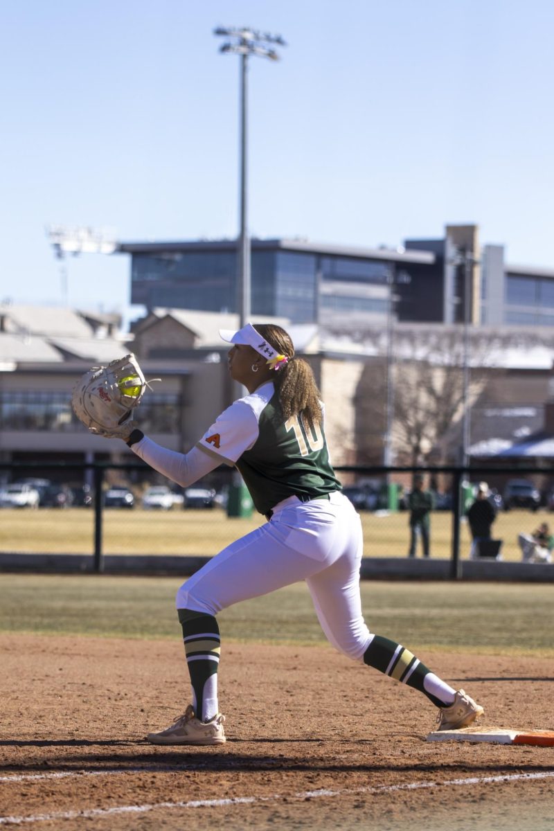 Jailey Wilson (10) catches a throw from teamate to complete an out during Colorado State University’s second game against University of South Dakota March 7. The Rams lost 2-6 at the CSU softball field.