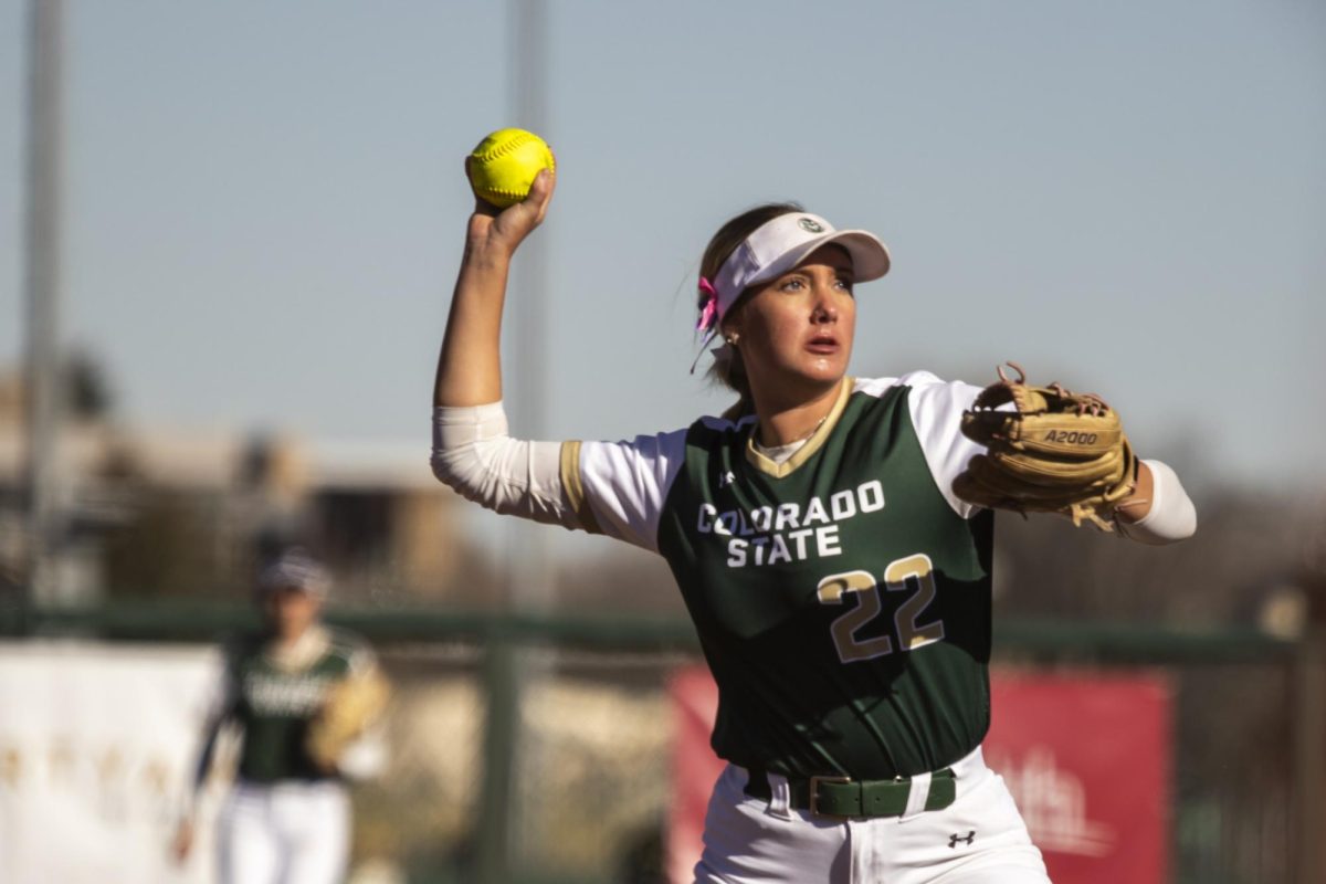 Kyra Smith (22) throws the ball to first during Colorado State University’s second game against University of South Dakota March 7. The Rams lost 2-6 at the CSU softball field.