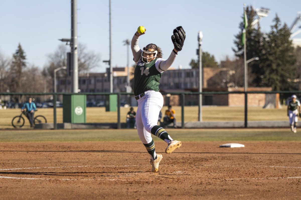 Giselle Bentley (14) throws a pitch during Colorado State University’s second game against University of South Dakota March 7. The Rams lost 2-6 at the CSU softball field.