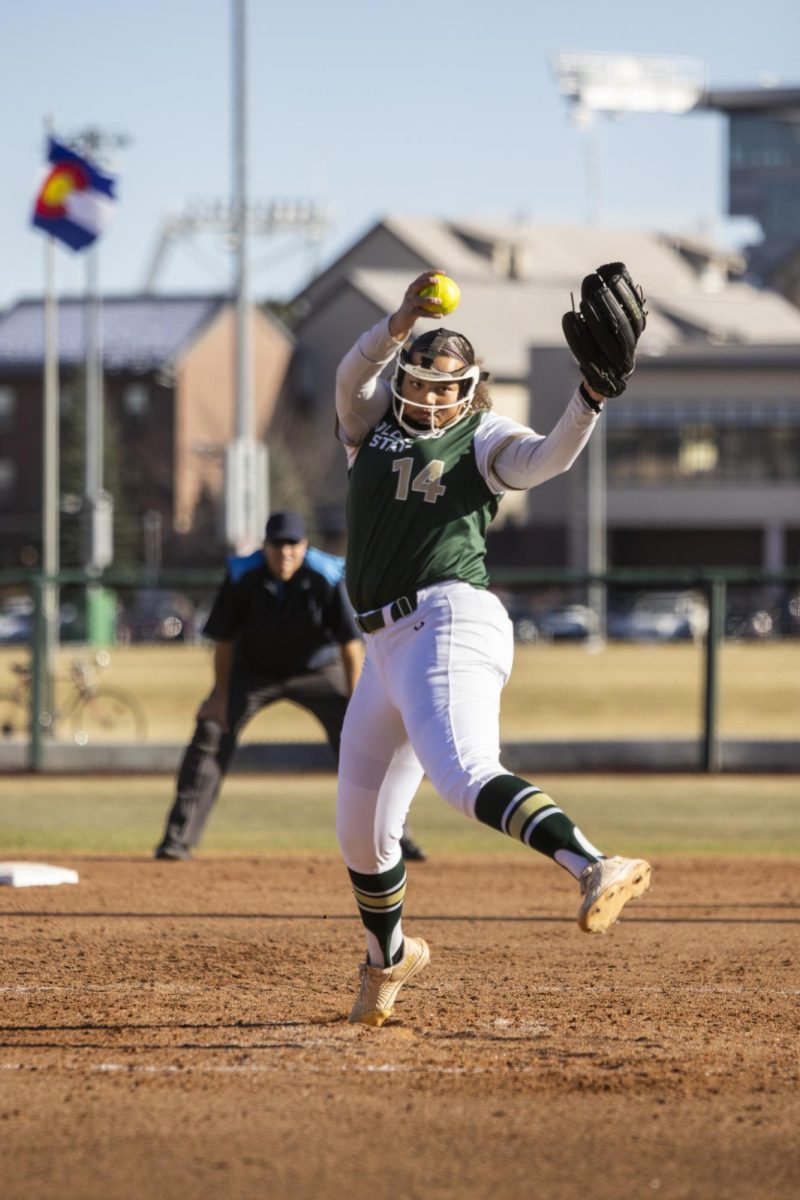Giselle Bentley (14) throws a pitch during Colorado State University’s second game against University of South Dakota March 7. The Rams lost 2-6 at the CSU softball field.