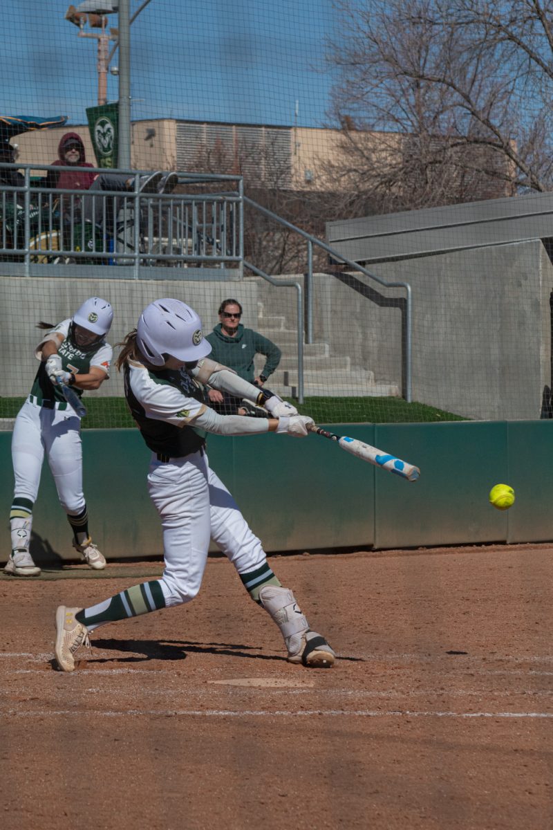 Junior Kaylynn English (28) swings for the ball during Colorado State University’s first game in a double header against the Univeristy of South Dakota Mar. 3. The Rams won this game 4-2.