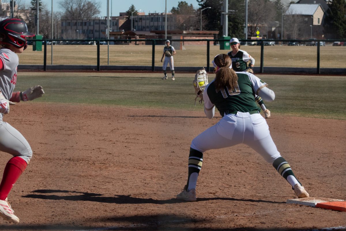 Junior Jailey Wilson catches a throw to first base during Colorado State University’s first game in a double header against the Univeristy of South Dakota Mar. 3 The Rams won this game 4-2 at the CSU softball field.