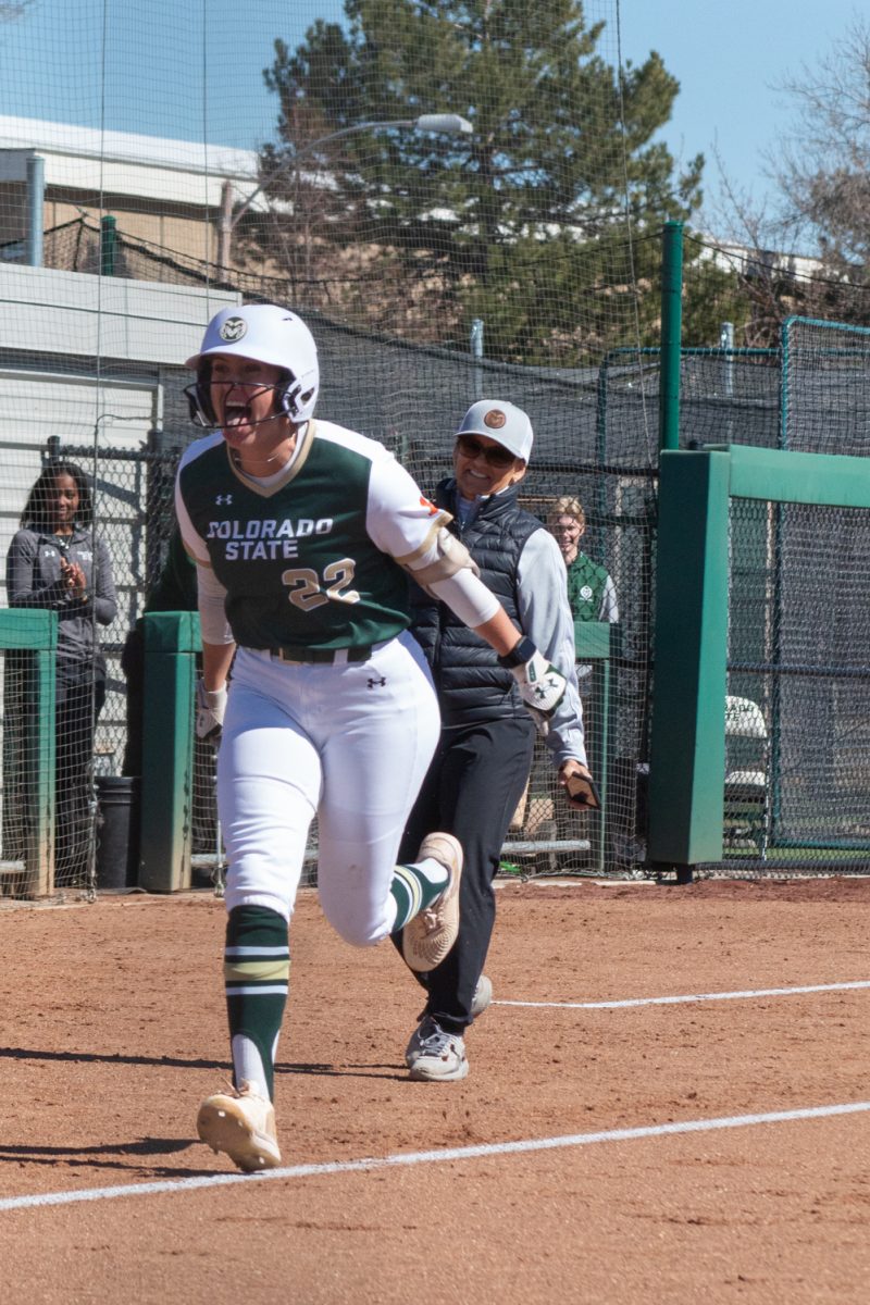 Sophomore Kyra Smith celebrates as she runs to home to score the Rams’ first run of Colorado State University’s game against the University of South Dakota Mar. 3.