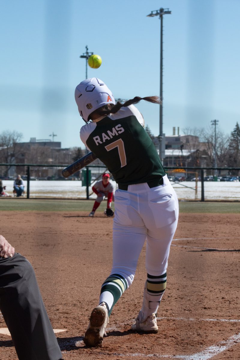 Sophomore Autumn Rutherford swings for the ball during Colorado State University’s first game in a double header against the Univeristy of South Dakota Mar. 3. The Rams won this game 4-2.