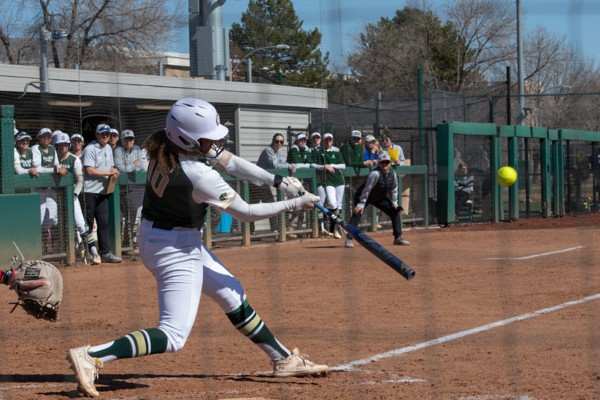 Junior Jailey Wilson hits a ball for a home run during Colorado State University’s first game in a double header against the Univeristy of South Dakota Mar. 3 The Rams won this game 4-2 at the CSU softball field.