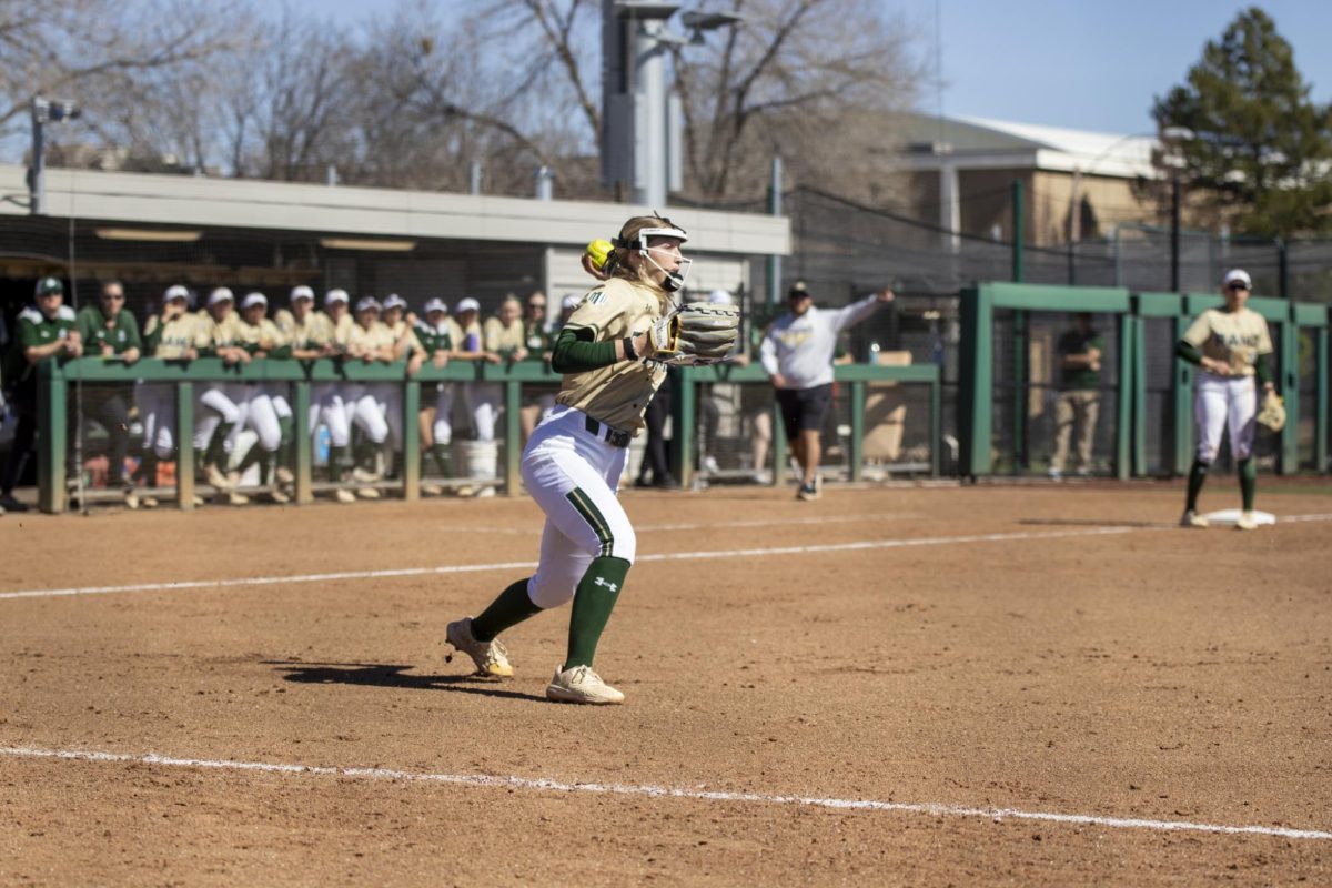 Regan Wick (12) throws ball to first base during Colorado State University’s game against South Dakota State March 8. The Rams secured an 8-0 shutout in five innings at the CSU Softball Field.