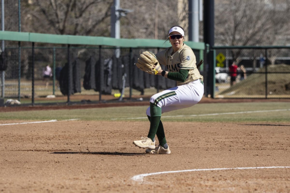 Rylee Gonzalez (18) attemps to throw the ball to first base after sucsessfully feilding it during Colorado State University’s game against South Dakota State March 8. The Rams secured an 8-0 shutout in five innings at the CSU Softball Field.