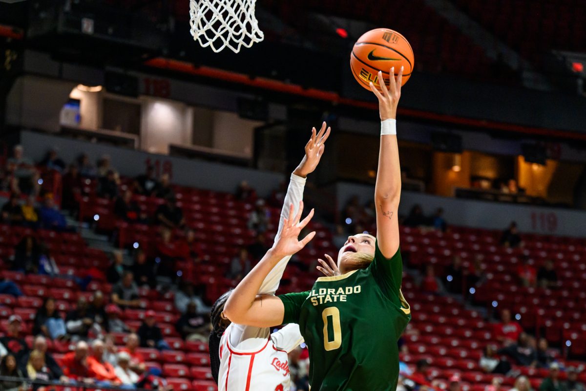 Colorado State University women's basketball forward Madelyn Bragg (0) faces pressure during a layup from a University of Nevada Las Vegas defender during CSU's game against UNLV in the Mountain West tournament March 9.