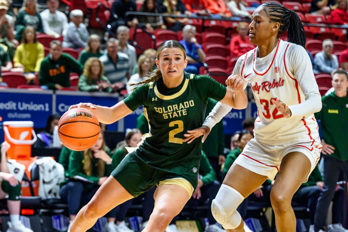 Colorado State University women's basketball guard Brooke Carlson (2) evades University of Nevada Las Vegas forward Meadow Roland (32) during the Mountain West tournament semifinals March 9. Carlson made 100% of her free throws and scored 19 total points for the Rams.