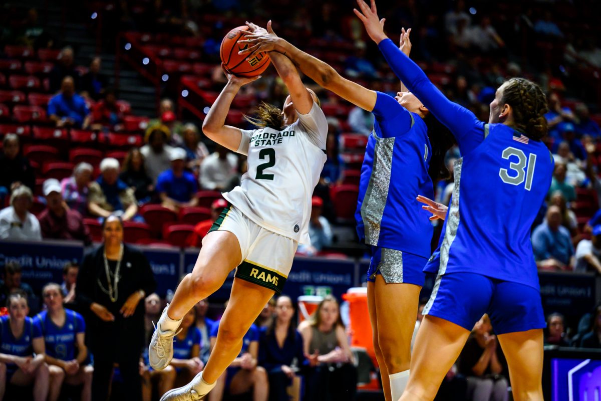Colorado State University women's basketball guard Brooke Carlson (2) pushes through Air Force Academy defense to get to the hoop during CSU's game against AFA for the Mountain West tournament finals March 10. Carlson scored 17 points for the Rams during the game, marking her as the Rams' top scorer for the second game in a row. 