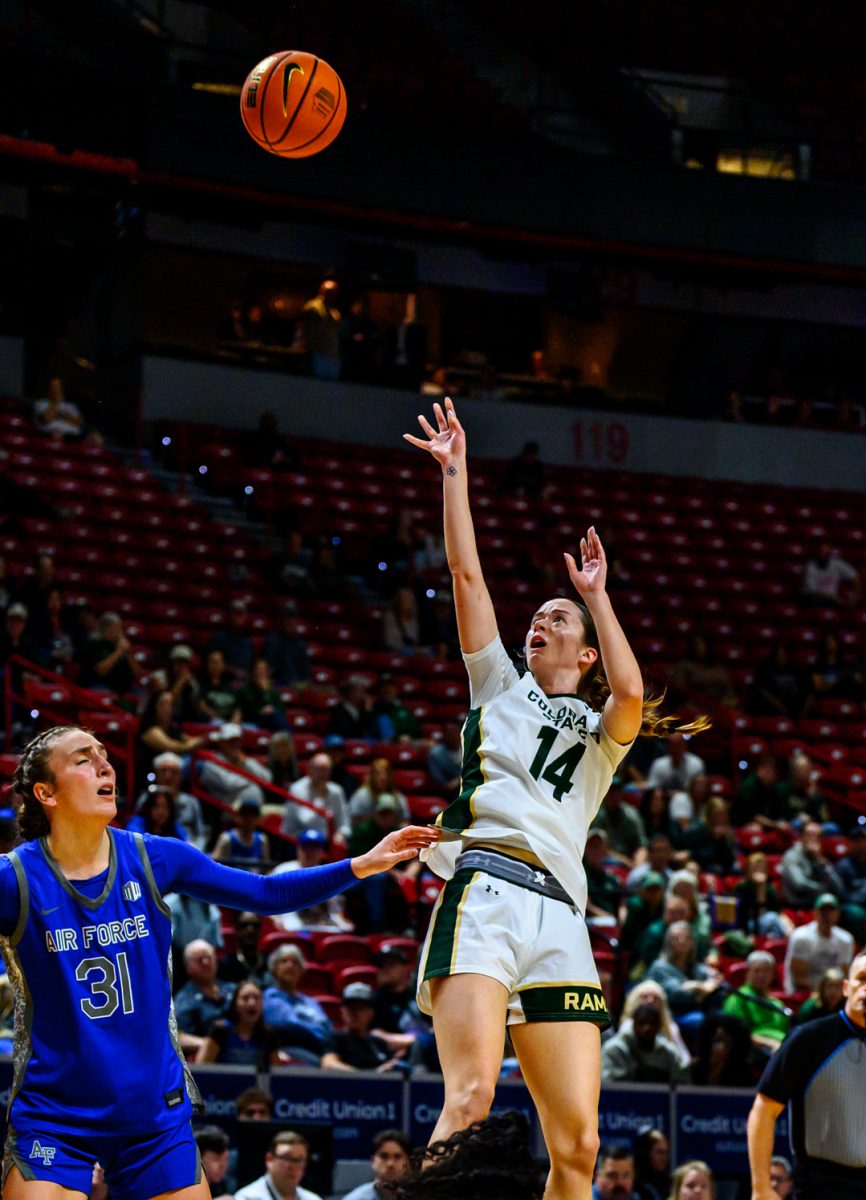 Colorado State University women's basketball guard Marta Leimane (14) launches the ball at the hoop to score a 3-pointer during CSU's Mountain West tournament game against Air Force Academy March 10. 