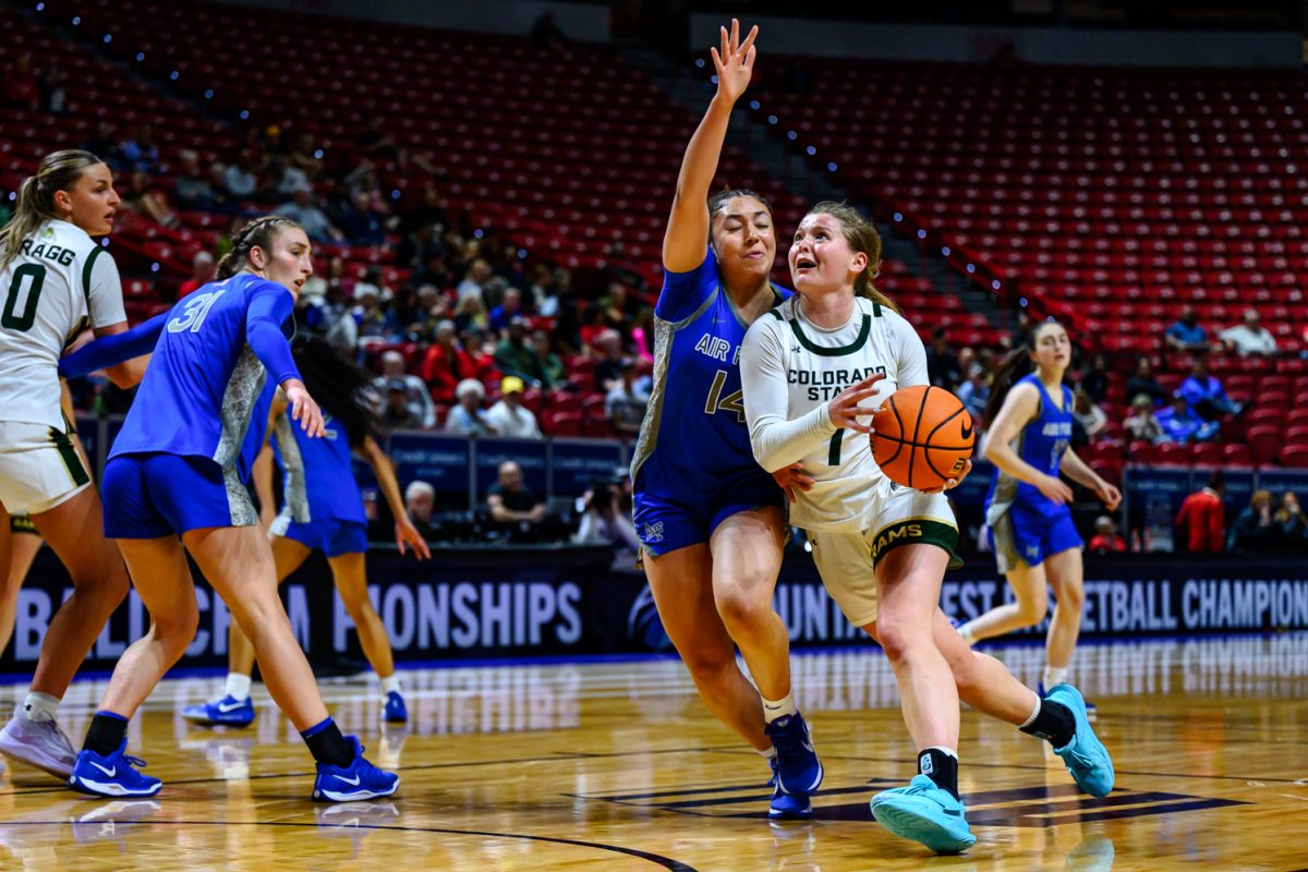 Colorado State University women's basketball guard Kloe Froebe (1) looks for a shot while facing pressure from Air Force Academy guard Bhret Clay (14) in CSU's game against AFA in the Mountain West tournament March 10.