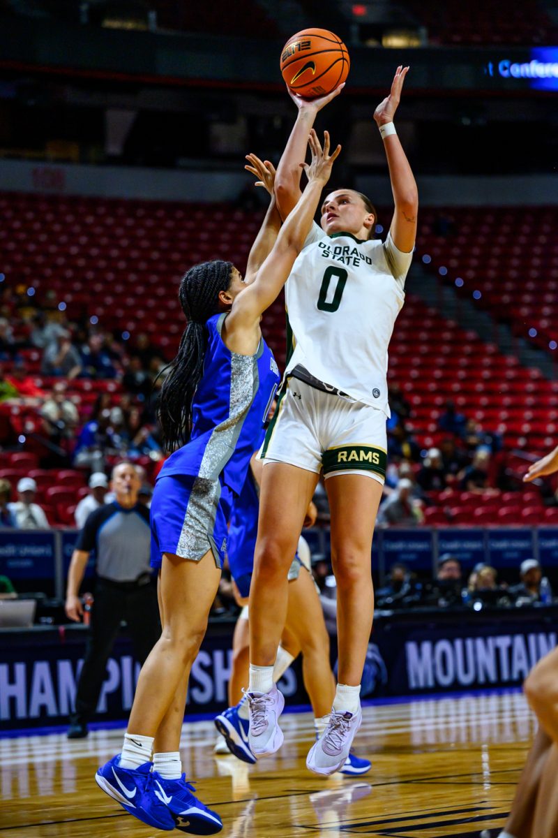 Colorado State University women's basketball forward Madelyn Bragg (0) attempts a shot while facing pressure from Air Force Academy's defense during CSU's game against AFA in the Mountain West tournament finals March 10. 
