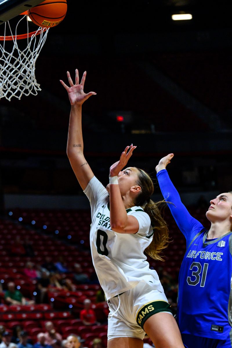 Colorado State University women's basketball forward Madelyn Bragg (0) launches the ball into the hoop during CSU's game against Air Force Academy in the final game of the Mountain West tournament March 10. Bragg scored 15 points for the Rams and made 7-of-8 total shots. 