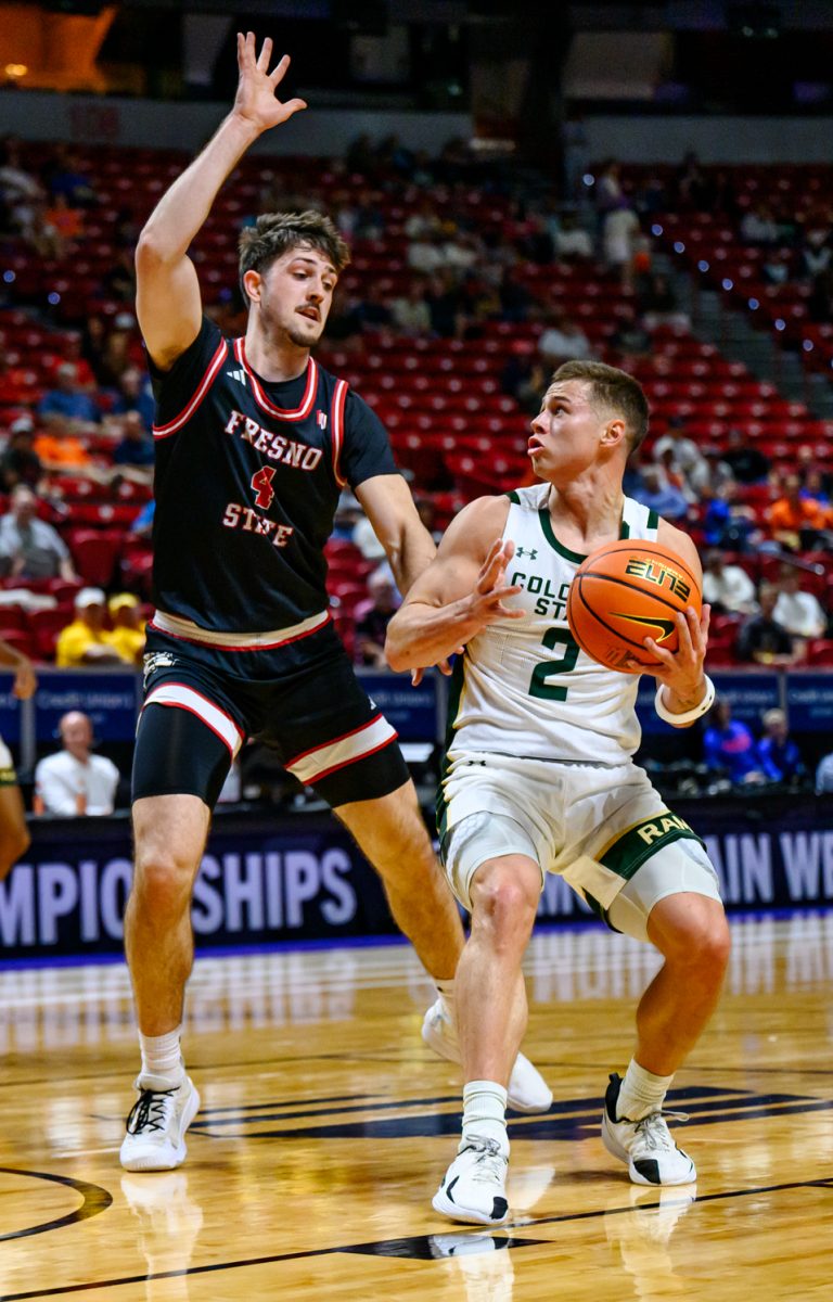 Colorado State University men's basketball guard Brandon Rechsteiner (2) looks for a shot while facing pressure from Fresno State University guard Cameron Faas (4) during CSU's game against FSU in the Mountain West tournament March 11. Rechsteiner scored seven points and went 2-for-2 in free throws. 